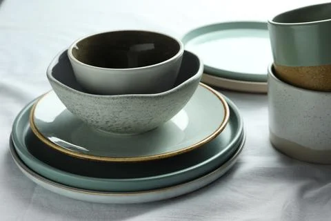 Stacked stylish empty dishware on table, closeup Stock Photos