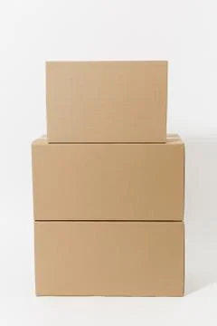 Stacked of three brown clear empty blank cardboard boxes isolated on white Stock Photos