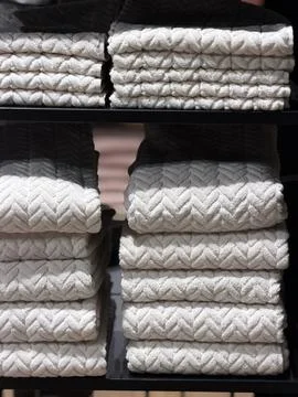 Stacked Towels on a Shelf Stock Photos