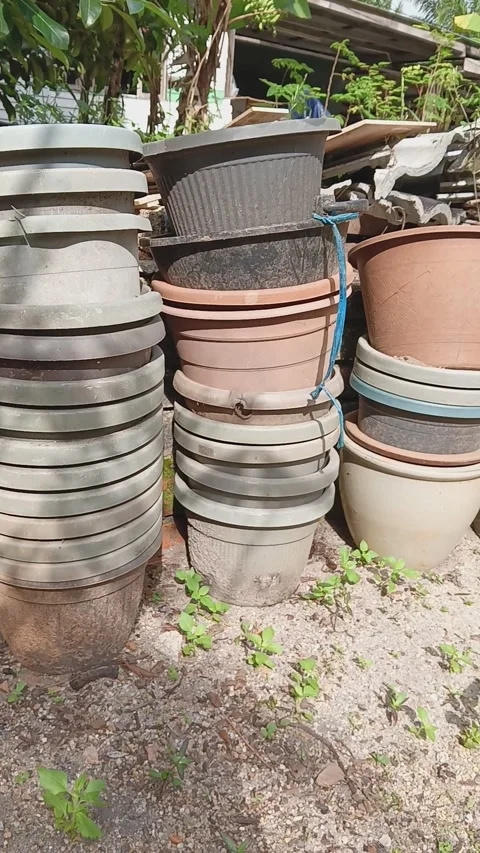 Stacked of various plastic flower pot at the garden Stock Footage 320477360