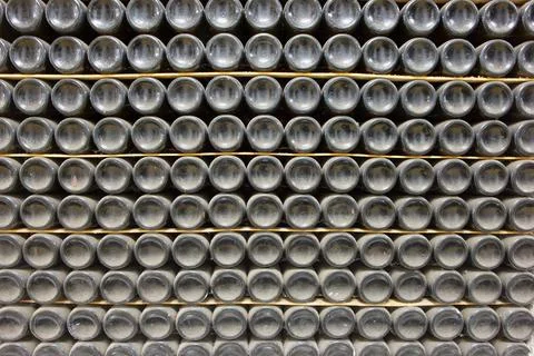 Stacked Wine Bottles in a Cellar Foto stock