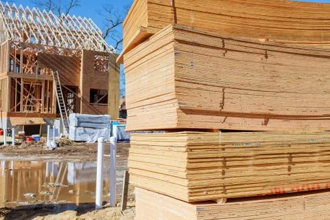 Stacked wooden building materials a stack of boards wood frame and beam const Stock Photos