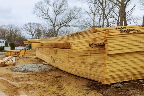 Stacked wooden building materials a stack of boards wood frame and beam const Stock Photos