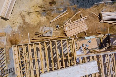Stacked wooden building materials stack of boards wood frame beam constructio Stock Photos