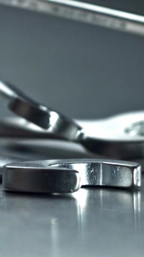 Stacked wrenches and spanners with reflective highlights Filmed on a high-speed Stock Footage 335395490