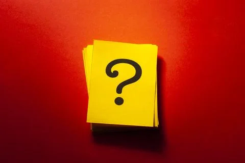 Stacked yellow cards with printed question mark 스톡 사진