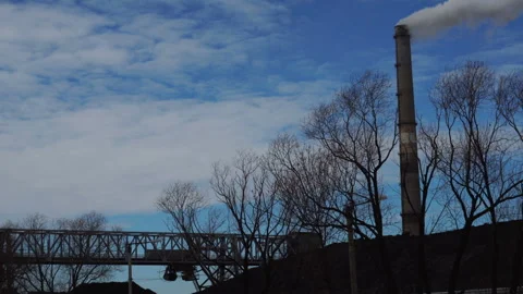 Stacker with a heap of coal next to the power plant Stock Footage 87178664
