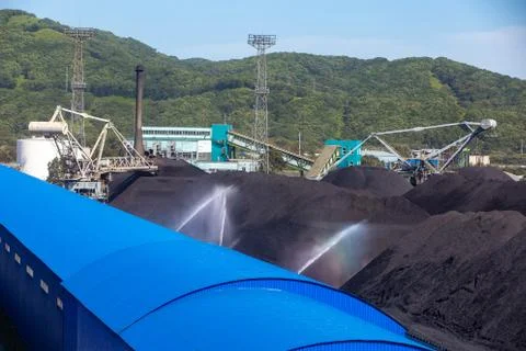 Stacker-reclaimer during loading and unloading of coal.  Stock Photos