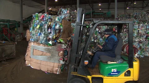 Stacker sorts of plastic waste on the factory recycling. Stock Footage 46432074