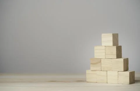 Stacking blank wooden cubes on table with copy space for input wording Stock Photos