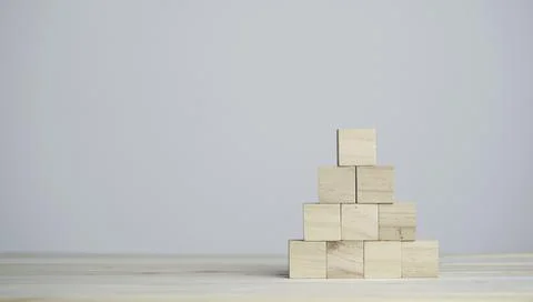 Stacking blank wooden cubes on table with copy space for input wording Stock Photos