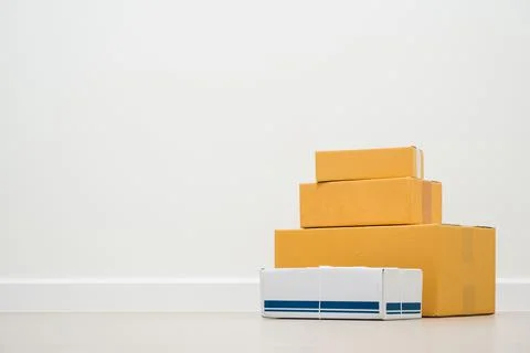 Stacking of box parcel cardboard mock up on blank space white background. Stock Photos