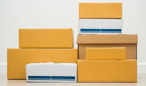 Stacking of box parcel cardboard mock up on blank space white background. Stock Photos