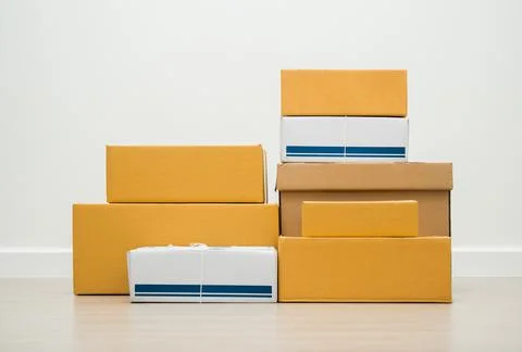 Stacking of box parcel cardboard mock up on blank space white background. Stock Photos