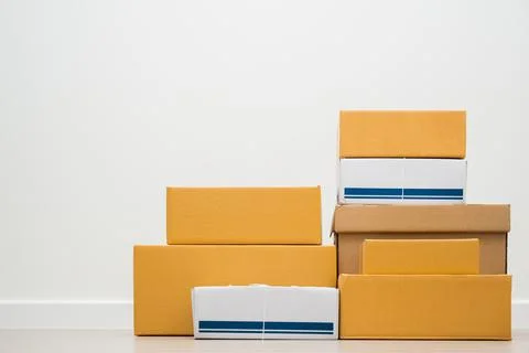 Stacking of box parcel cardboard mock up on blank space white background. Stock Photos