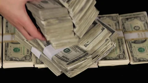 Stacking cash in 100 dollar bills - money pile woman hands Stock Footage 201024665