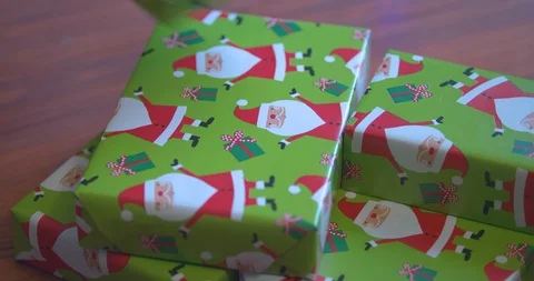 Stacking Christmas Presents in a Pile Stock Footage 100799592