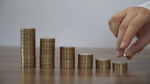 Stacking Coins in Columns Stock Footage 87080128