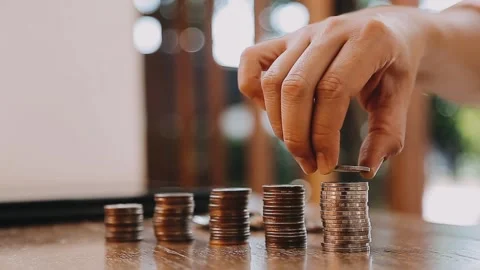 Stacking coins demonstrates financial growth and savings in money management Stock Footage 325420732