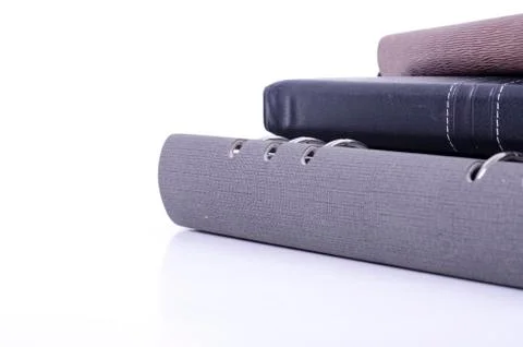 Stacking diaries on white background. negative space for text Stock-Fotos