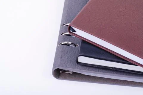 Stacking diaries on white background. negative space for text Stock Photos