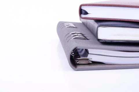 Stacking diaries on white background. negative space for text Stock-Fotos