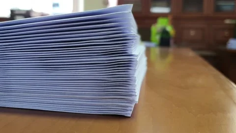 Stacking document papers on working desk in office Stock Footage 146102363