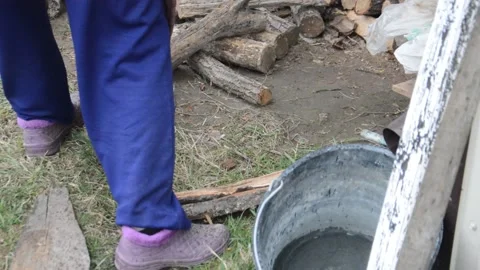 Stacking firewood after cutting for drying and heating the house Stock Footage 183315922