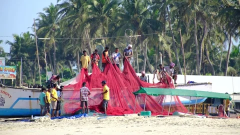 Stacking up fishing nets in Goa Video stock 332792585