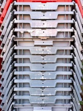 Stacking Gray and Red Plastic Boxes Textures Foto stock
