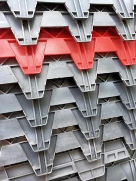 Stacking Gray and Red Plastic Boxes Textures Stock Photos