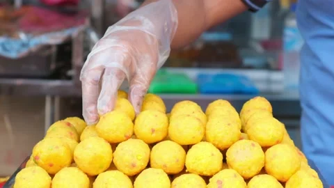 Stacking laddu slowmo Stock Footage 142720415