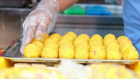 Stacking laddu slowmo Stock Footage 142720447