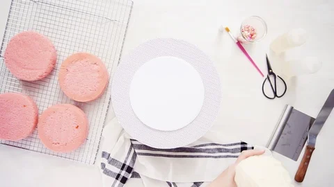 Stacking layers together of pink birthday cake. Stock Footage 97750329