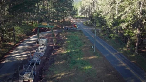 Stacking logging truck trailers, Rotorua, New Zealand Stock Footage 135613012