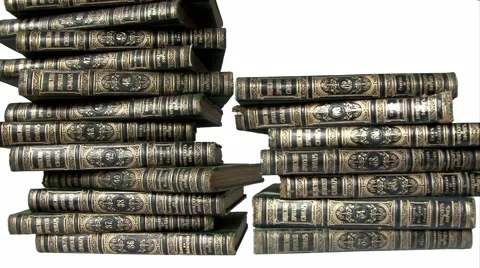 Stacking up old books isolated on white Video stock 43832194