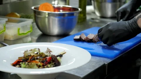 Stacking Steak on a Dish Stock Footage 131632654