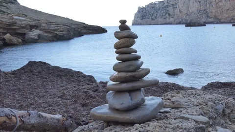 Stacking stones on the beach. Stock Footage 82287936