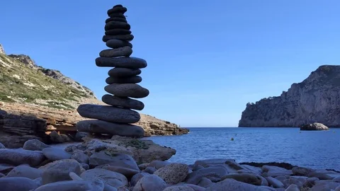 Stacking stones on the beach. Spain. Stock Footage 85157196