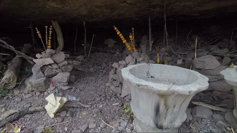 Stacking Stones in Mountain Cave with Offering, Vat Phou Temple Complex, Laos Stock Footage 279252767