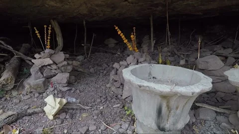 Stacking Stones in Mountain Cave with Offering, Vat Phou Temple Complex, Laos Stock Footage 279252809