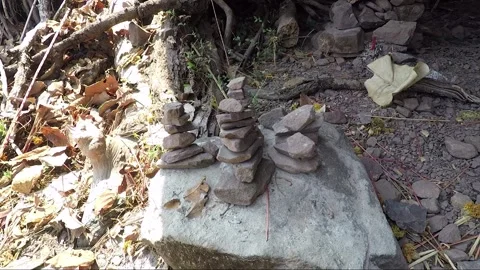 Stacking Stones in Mountain Cave with Offering, Vat Phou Temple Complex, Laos Stock Footage 279252982