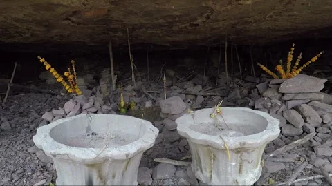 Stacking Stones in Mountain Cave with Offering, Vat Phou Temple Complex, Laos Stock Footage 279253119