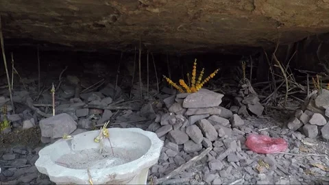 Stacking Stones in Mountain Cave with Offering, Vat Phou Temple Complex, Laos Stock Footage 279253185