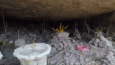 Stacking Stones in Mountain Cave with Offering, Vat Phou Temple Complex, Laos Stock Footage 279253187