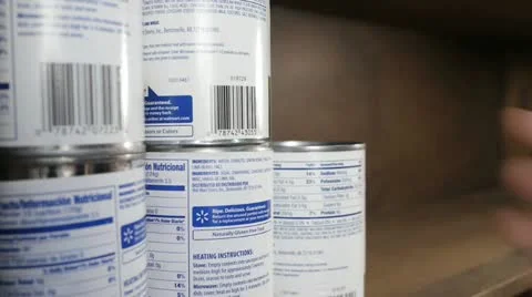 Stacking & storing canned food - Preppers - doomsday Stock Footage