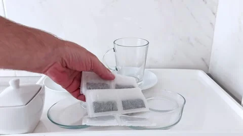 Stacking Tea Bags in Style: A Clean Prep Scene with Ceramic Accents Stock-Footage 318278783