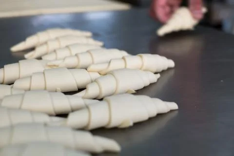 Stacking Uncooked Croissant Rolls Stock-Fotos