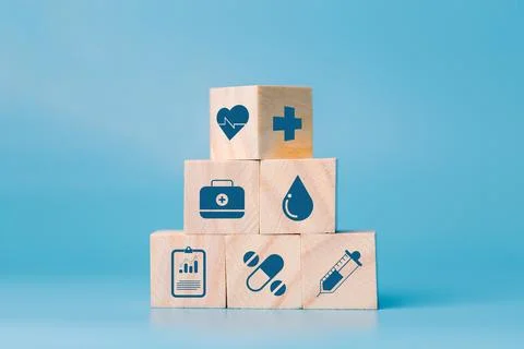Stacking wooden block cube which print screen health care and medical icons.. Stock Photos