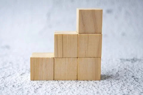 Stacking wooden cubes with customizable space for text. Copy space concept. Stock Photos
